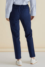 A model wearing the Carey Cotton Blend Chino Jogger in colour Navy (Blue), from the back