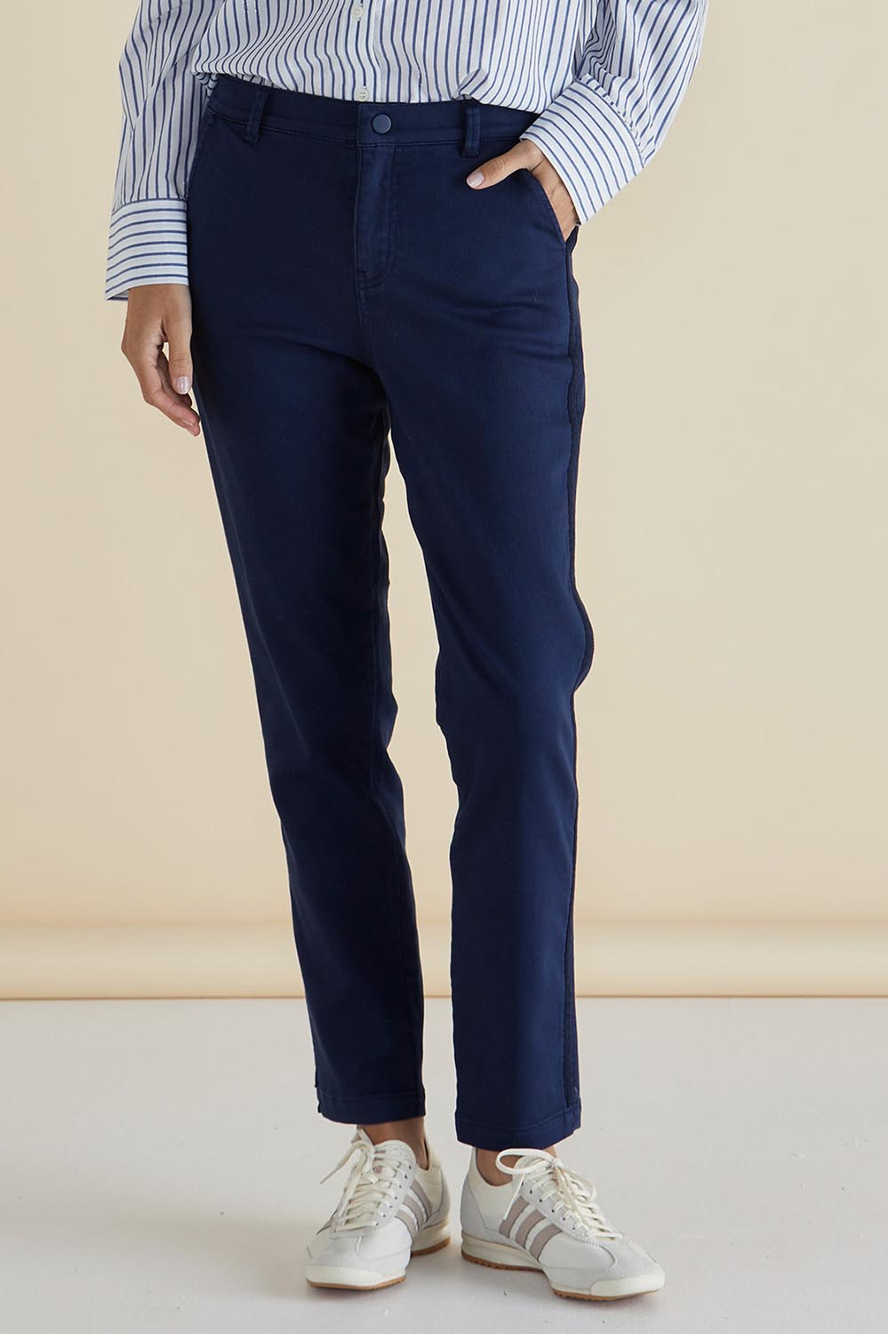 A model wearing the Carey Cotton Blend Chino Jogger in colour Navy (Blue), from the front, cropped image