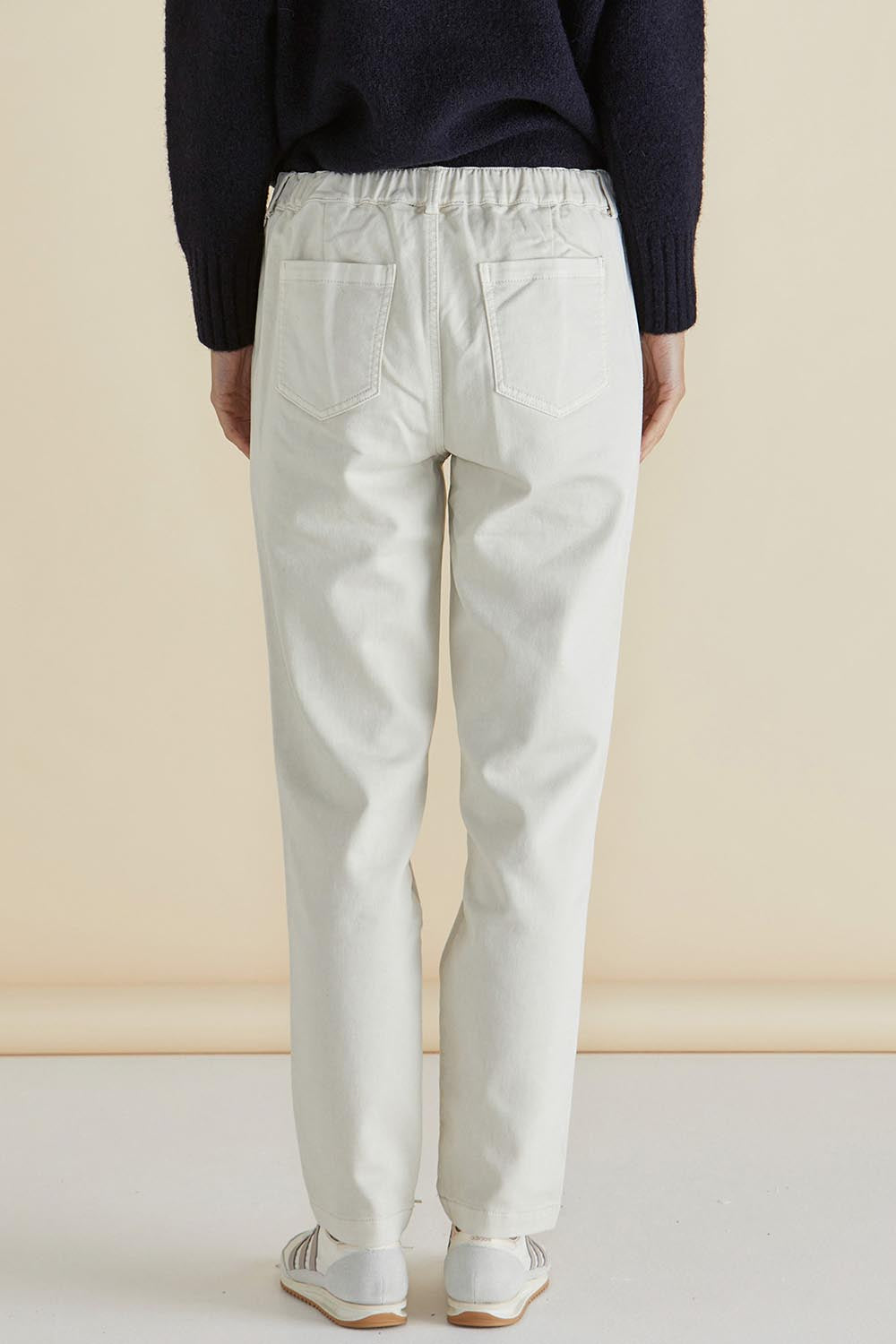 A model wearing the Carey Cotton Blend Chino Jogger in colour Stone, from the back