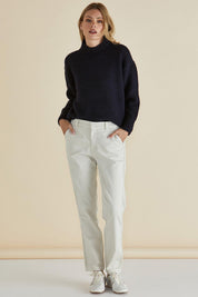 A model wearing the Carey Cotton Blend Chino Jogger in colour Stone, from the front, showing the whole outfit