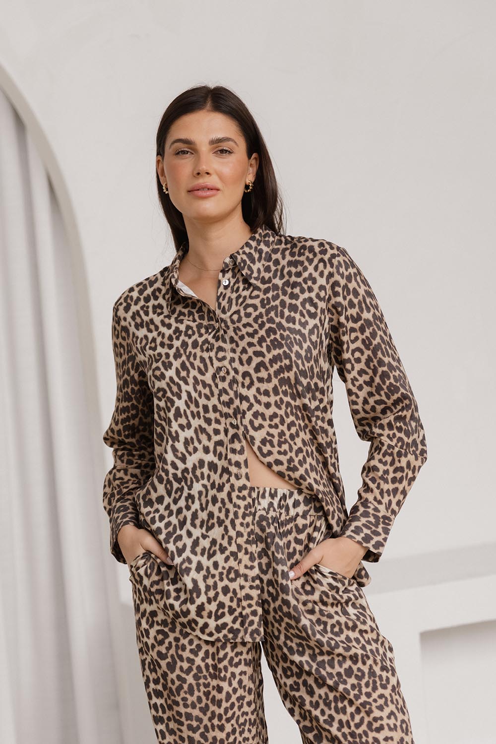 A model wearing the Lexi Shirt in colour Leopard, from the front, showing the whole outfit