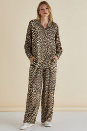 A model wearing the Lexi Shirt in colour Leopard, from the front, showing the whole outfit