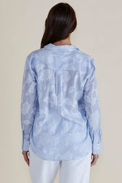 A model wearing the Lace Stripe Cotton Shirt in colour Lacefloral (Blue), from the back