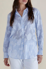 A model wearing the Lace Stripe Cotton Shirt in colour Lacefloral (Blue), from the front, cropped image