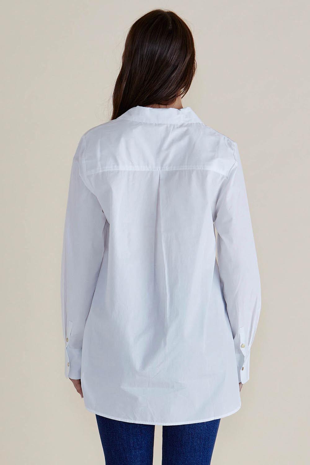 A model wearing the Shellie Cotton Poplin Shirt in colour White (White), from the back