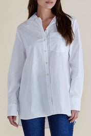 A model wearing the Shellie Cotton Poplin Shirt in colour White (White), from the front, cropped image