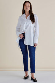 A model wearing the Shellie Cotton Poplin Shirt in colour White (White), from the front, showing the whole outfit