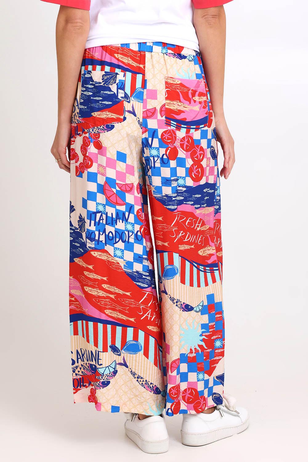 Model Madelinec wearing size 10 of the Sable Wide Leg Pant – Mediterranean in colour Mediterranean, from an angle