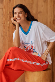 Model Genericm wearing size sample of the Sable Wide Leg Pant – Red in colour Red, from an angle
