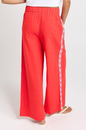 Model Genericm wearing size sample of the Sable Wide Leg Pant – Red in colour Red, from the back