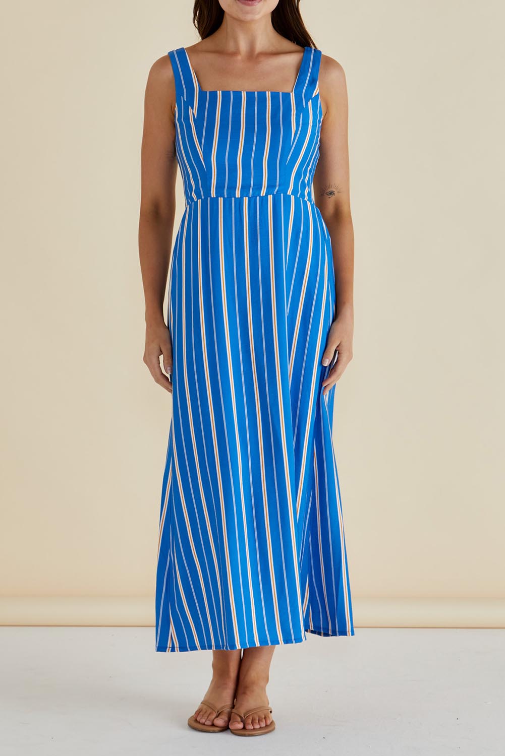 A model wearing the Tegan Midi Dress in colour Blue (Blue), from the front, cropped image