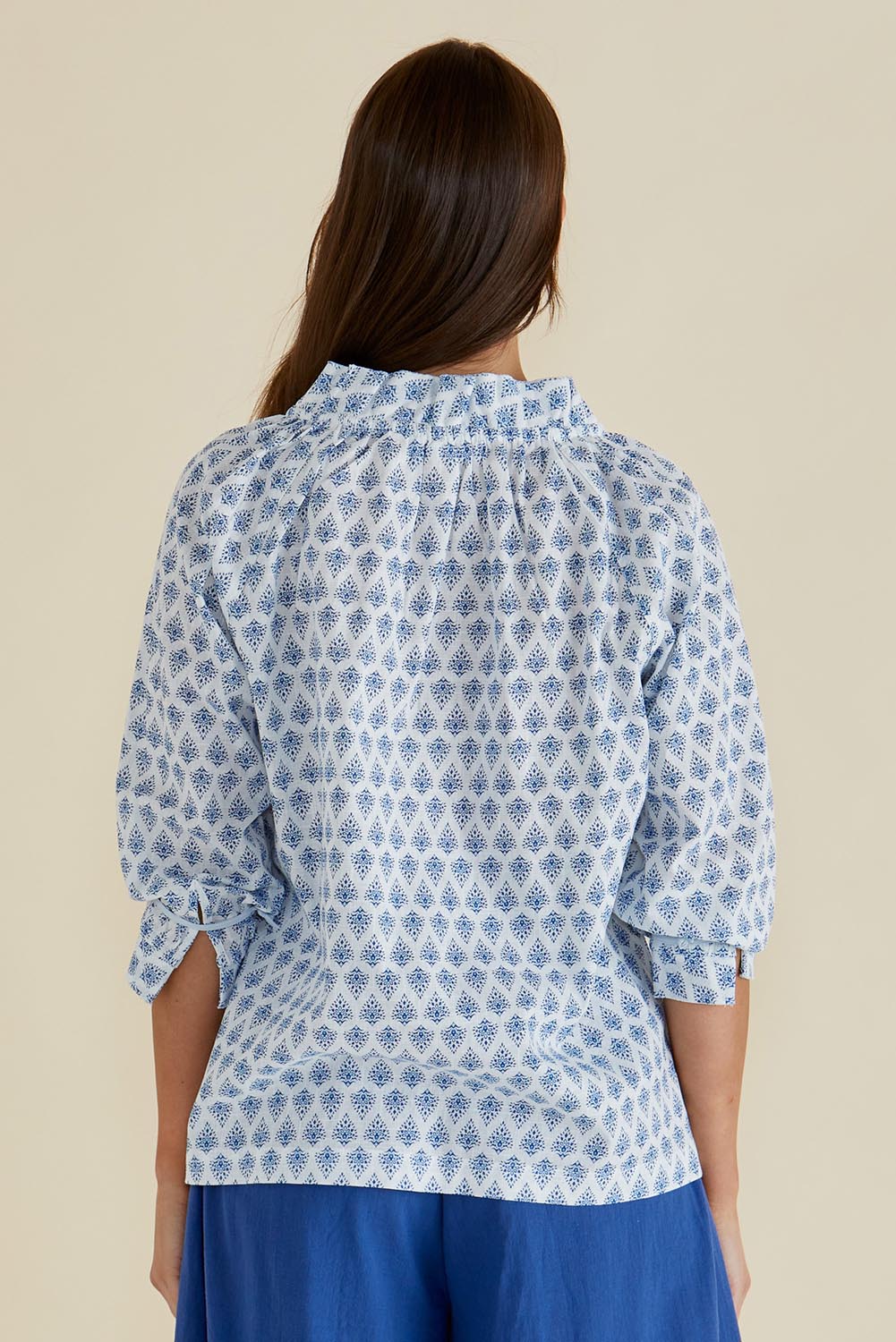 A model wearing the Charli Cotton Blouse in colour Blue (Blue), from the back