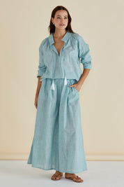 A model wearing the Charli Cotton Blouse in colour Green (Green), from the front, showing the whole outfit