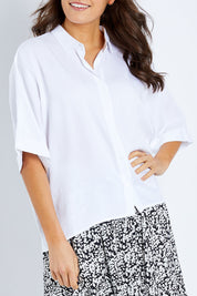 Model Elhana wearing size 10 of the Ellis Shirt in colour White (White), from the front, cropped image