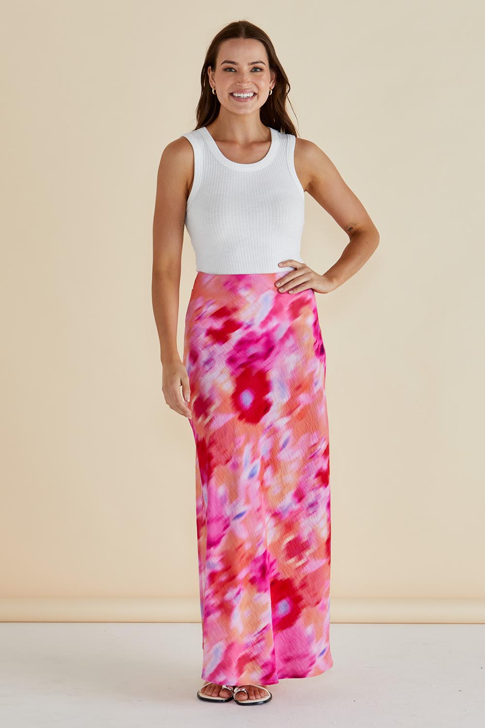 A model wearing the Mindy Skirt in colour Floral (Pink), from the front, showing the whole outfit