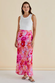 A model wearing the Mindy Skirt in colour Floral (Pink), from the front, showing the whole outfit