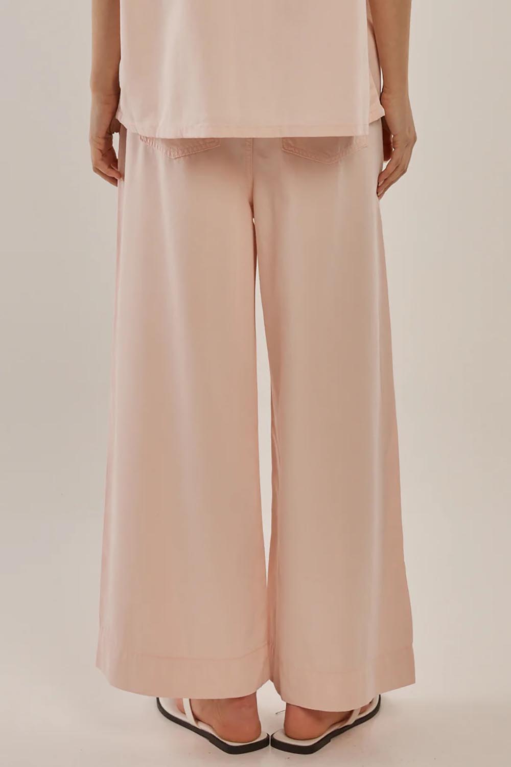 A model wearing the Saffra Relax Leg Jean in colour Pink (Pink), from the back