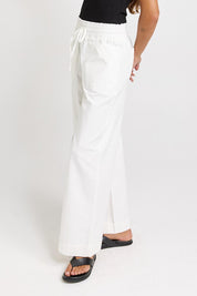 Model Genericm wearing size sample of the Saffra Relax Leg Jean – White in colour White, from an angle