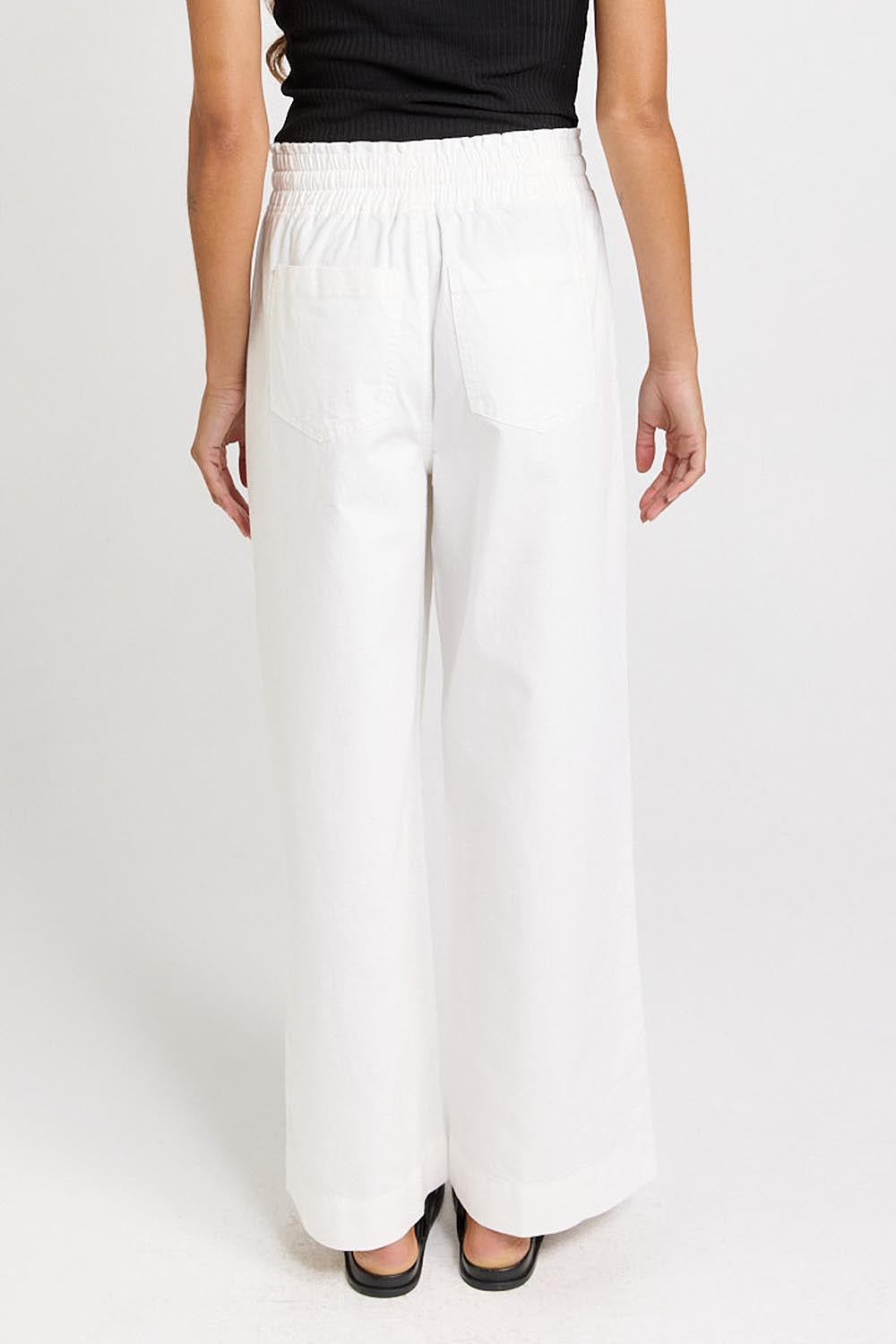 Model Genericm wearing size sample of the Saffra Relax Leg Jean – White in colour White, from the back
