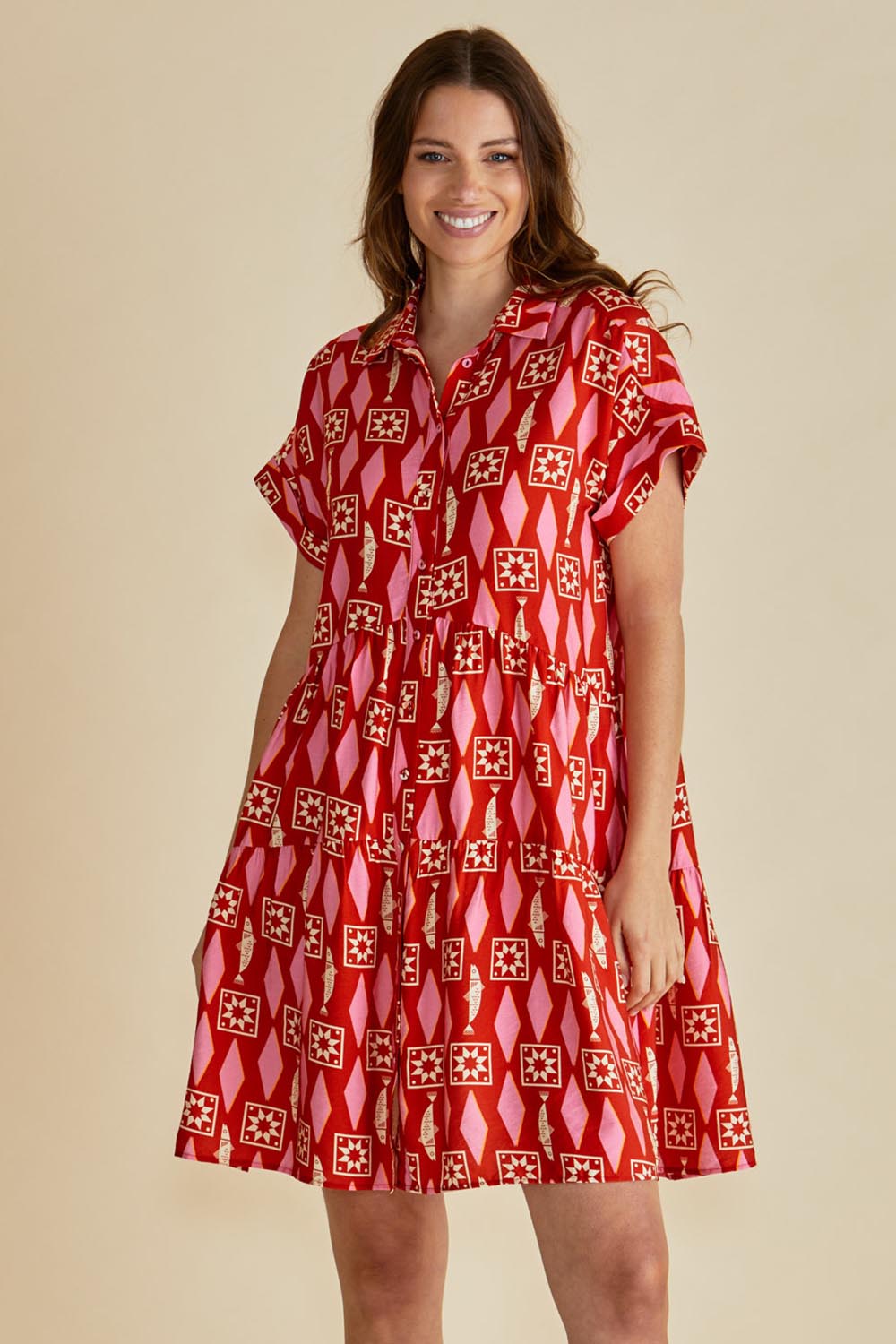 A model wearing the Copacabana Shirt Dress in colour Sardinia (Red), from the front, cropped image