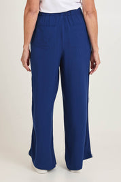 Model Sandy wearing size 10 of the Rio Reef Pant in colour Navy (Blue), from the back