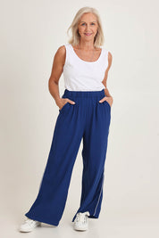 Model Sandy wearing size 10 of the Rio Reef Pant in colour Navy (Blue), from the front, showing the whole outfit