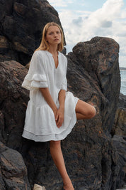 A model wearing the Malibu Cotton Dress in colour White (White), from the front, showing the whole outfit