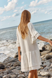 A model wearing the Malibu Cotton Dress in colour White (White), from the front, showing the whole outfit