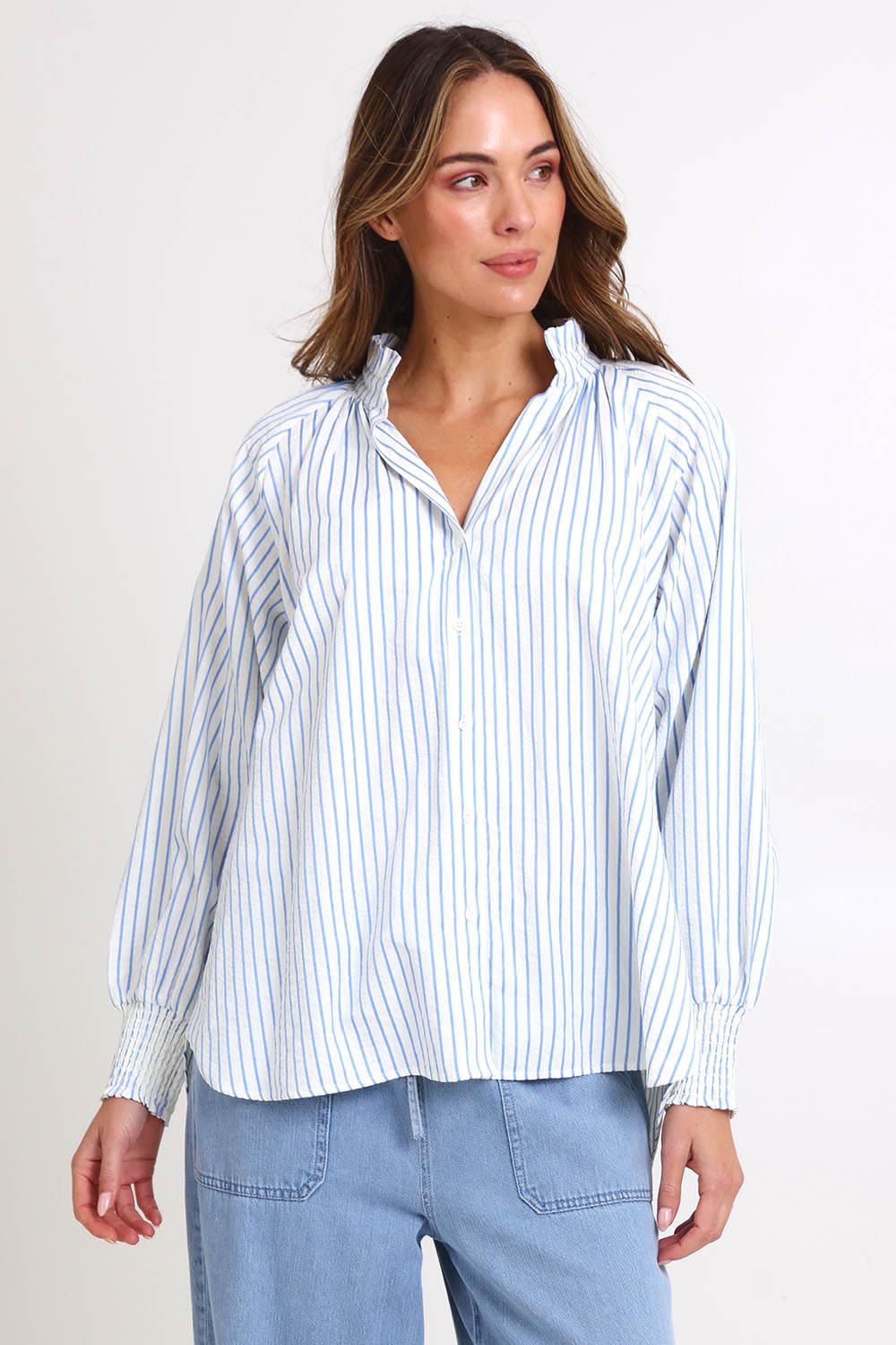 Model Madelinec wearing size 10 of the Romi Shirt – Blue in colour Blue, in a cropped view
