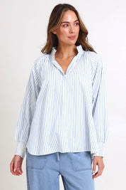 Model Madelinec wearing size 10 of the Romi Shirt – Blue in colour Blue, in a cropped view