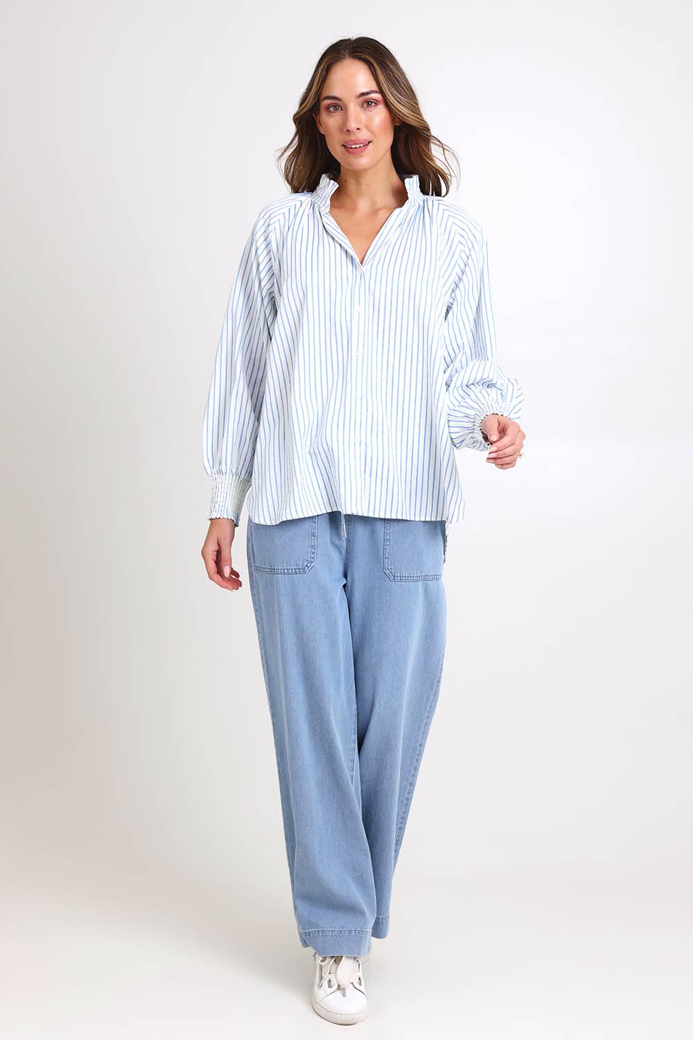Model Madelinec wearing size 10 of the Romi Shirt – Blue in colour Blue, from the front
