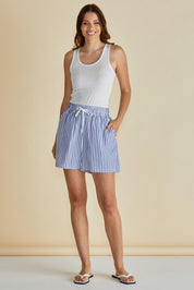 A model wearing the Jovie Cotton Blend Shorts in colour Navystripe (Blue), from the front, showing the whole outfit