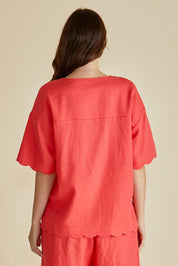 A model wearing the Scarlett Shirt in colour Red (Red), from the back