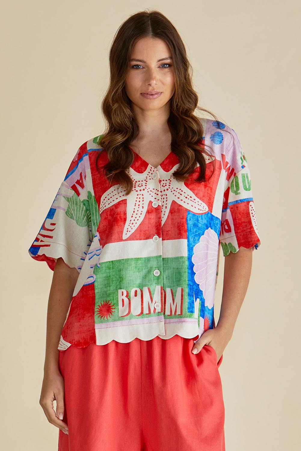 A model wearing the Scarlett Shirt in colour Seashell, from the front, cropped image