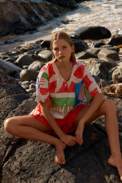 A model wearing the Scarlett Shirt in colour Seashell, from the front, showing the whole outfit