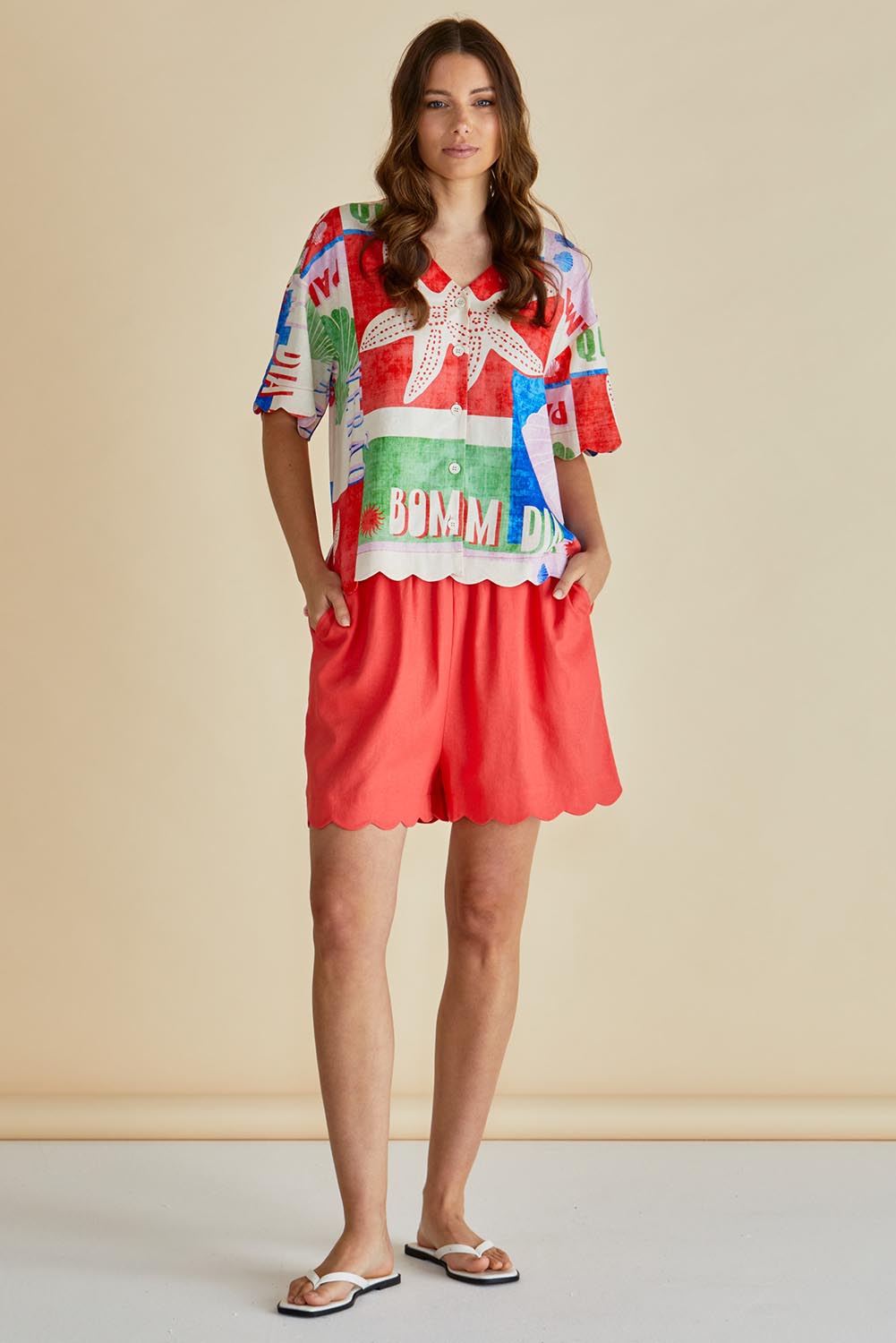 A model wearing the Scarlett Shirt in colour Seashell, from the front, showing the whole outfit