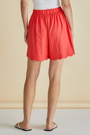 A model wearing the Seraphina Short in colour Red (Red), from the back