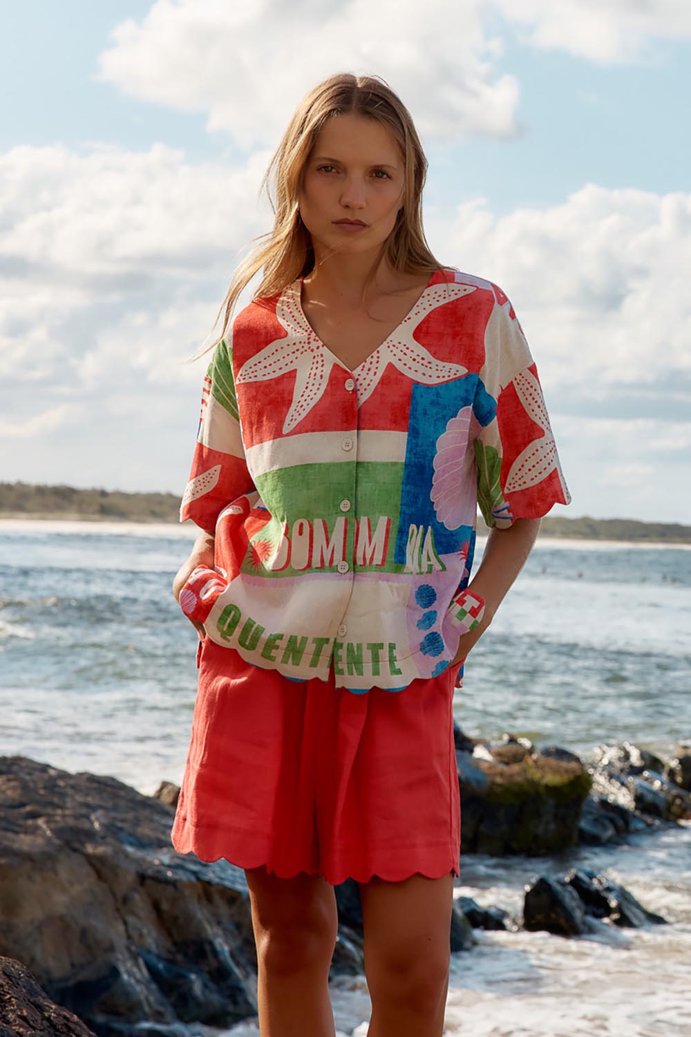 A model wearing the Seraphina Short in colour Red (Red), from the front, showing the whole outfit