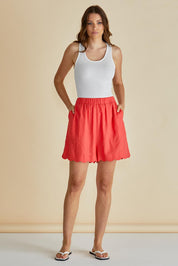 A model wearing the Seraphina Short in colour Red (Red), from the front, showing the whole outfit