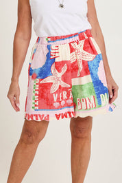 Model Sandy wearing size 10 of the Seraphina Short in colour Seashell, from the front, cropped image