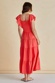 A model wearing the Sadie Dress in colour Red (Red), from the back