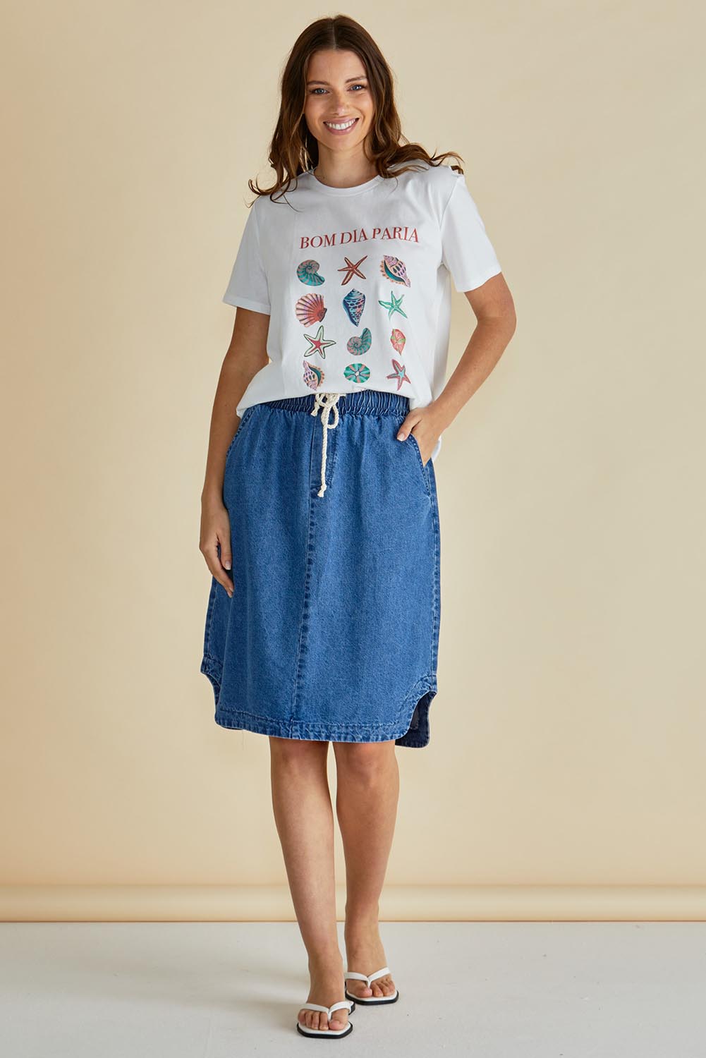 A model wearing the Dara Denim Skirt in colour Blue (Blue), from the front, showing the whole outfit