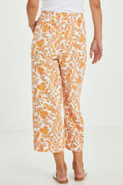 Model Alice wearing size 10 of the Parker Pant in colour Paisley (White), from the back