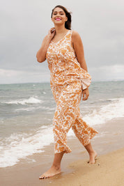 A model wearing the Parker Pant in colour Paisley (White), from the front, showing the whole outfit
