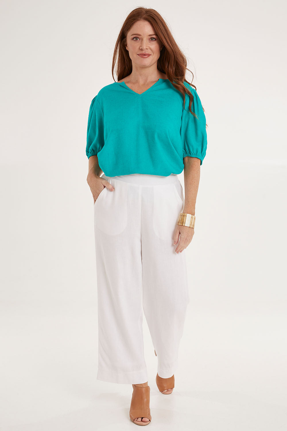 Model Sally wearing size 10 of the Parker Pant in colour White (White), from the front, showing the whole outfit