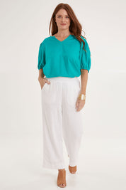 Model Sally wearing size 10 of the Parker Pant in colour White (White), from the front, showing the whole outfit