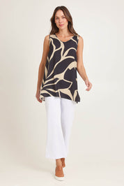 Model Madeline wearing size 10 of the Lana Tunic Tank in colour Floral (Black), from the front, showing the whole outfit