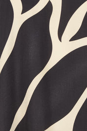 Product shot of the Lana Tunic Tank in colour Floral (Black), detail
