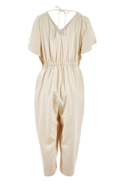Product shot of the Jules Linen Jumpsuit in colour Wheat, from the back