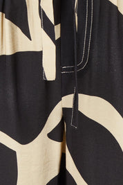 Product shot of the Sutton Relax Pant in colour Floral (Black), detail